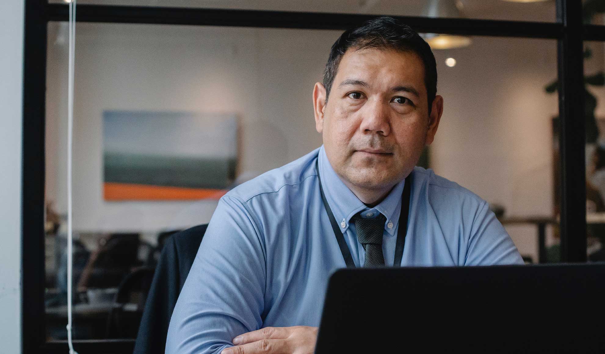 Man sitting behind Laptop Man sitting behind Laptop